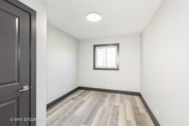 spare room featuring light hardwood / wood-style floors