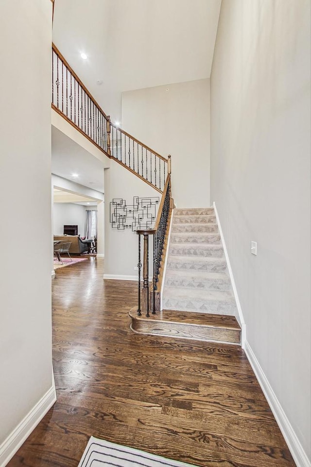 staircase featuring hardwood / wood-style flooring