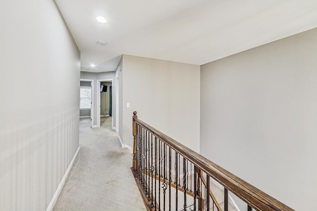 corridor with light colored carpet