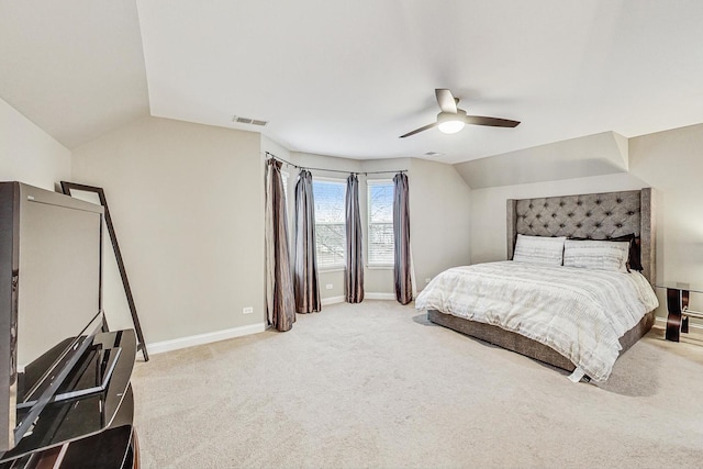 bedroom featuring ceiling fan, carpet floors, and vaulted ceiling