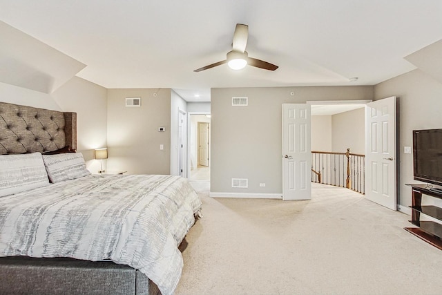 bedroom featuring ceiling fan and light carpet