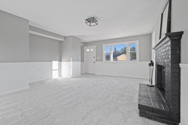 carpeted living room featuring a brick fireplace