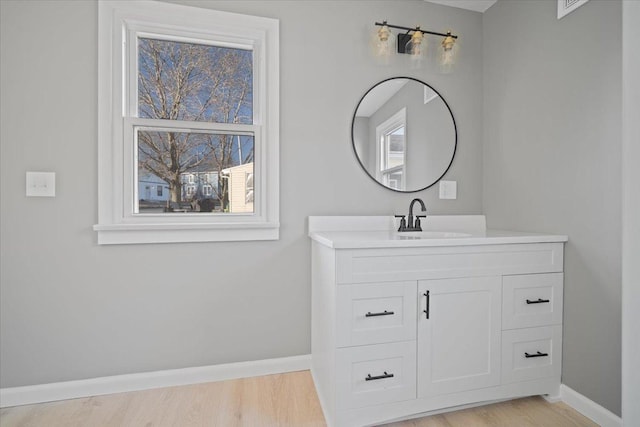 bathroom with vanity and hardwood / wood-style flooring