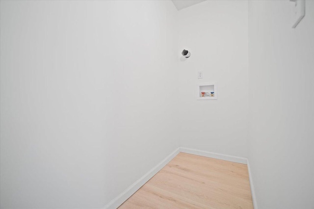 laundry room with wood-type flooring and washer hookup