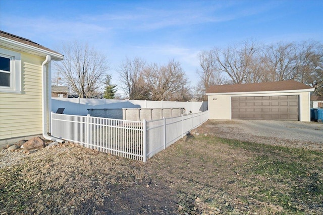 view of yard with an outdoor structure and a garage