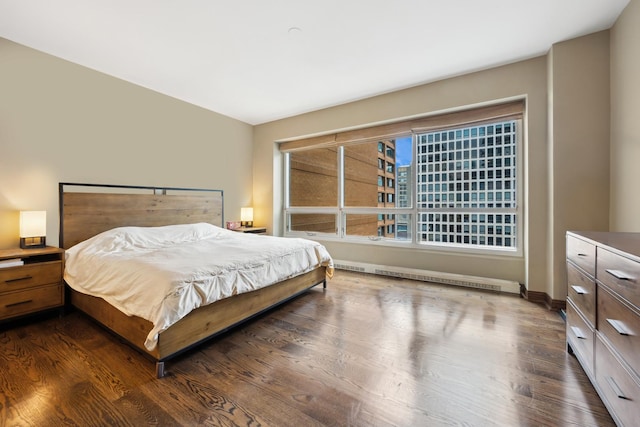 bedroom with dark hardwood / wood-style flooring