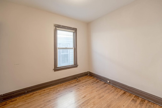 unfurnished room with light hardwood / wood-style flooring