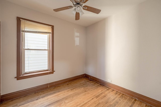 unfurnished room featuring light wood-type flooring and ceiling fan