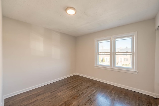 unfurnished room featuring dark hardwood / wood-style floors