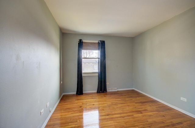 spare room with light hardwood / wood-style floors