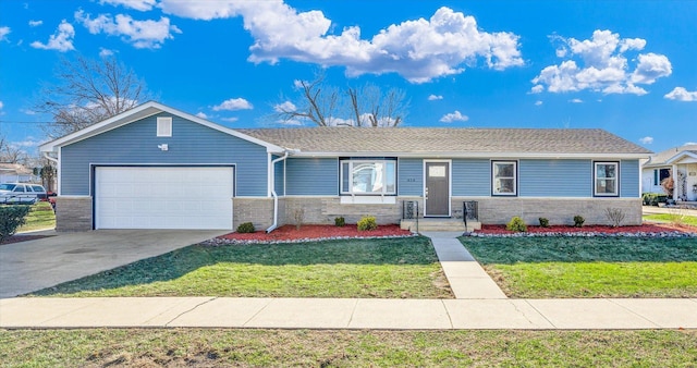 ranch-style house featuring a front yard and a garage