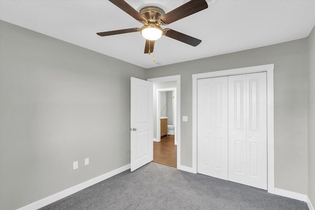 unfurnished bedroom with carpet, a closet, and ceiling fan