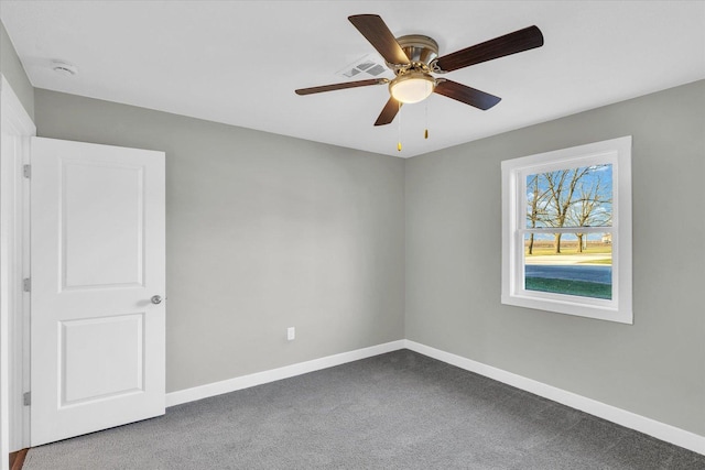 empty room featuring ceiling fan and carpet floors