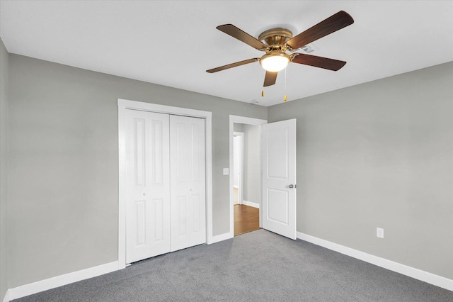 unfurnished bedroom featuring carpet flooring, a closet, and ceiling fan