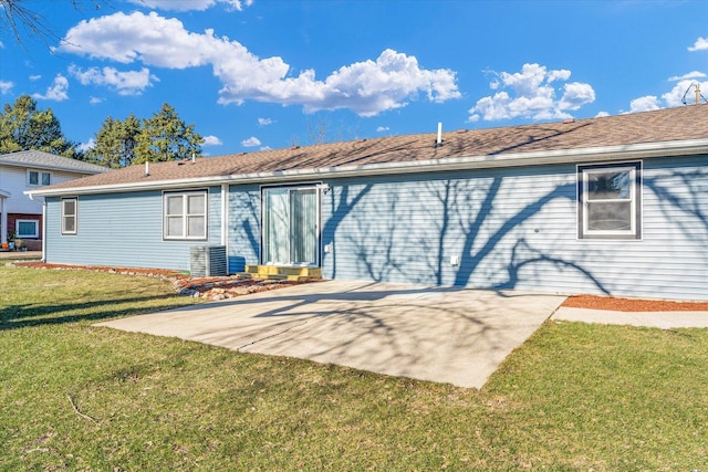 rear view of house featuring a yard and a patio area