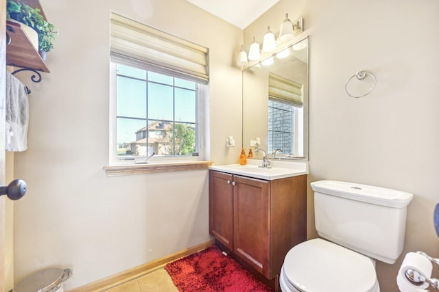 bathroom with tile patterned floors, vanity, and toilet