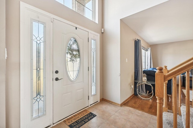 tiled foyer with plenty of natural light