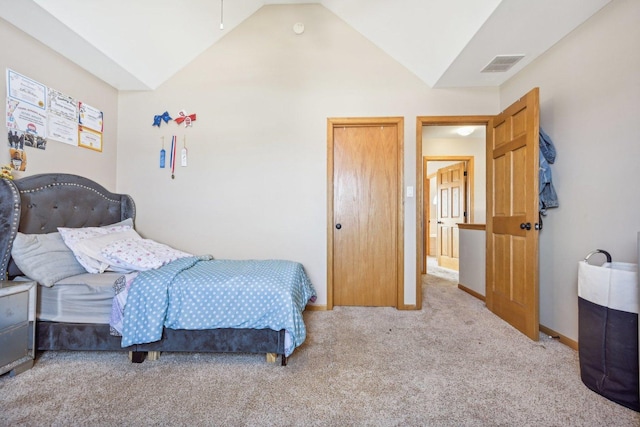 carpeted bedroom featuring vaulted ceiling