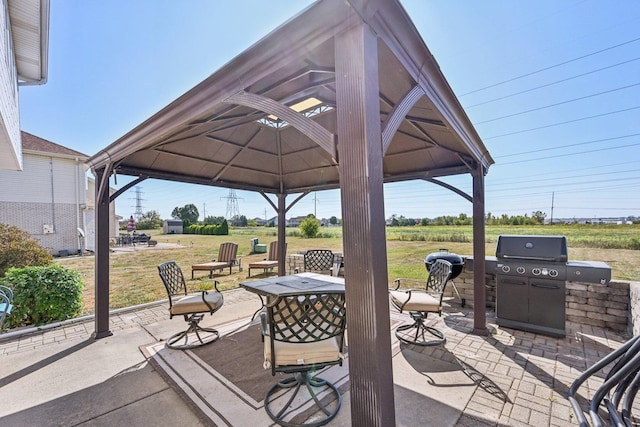 view of patio with a gazebo, an outdoor kitchen, and area for grilling