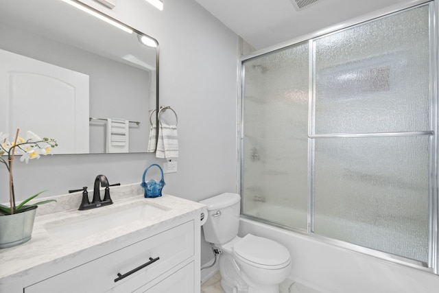 full bathroom with shower / bath combination with glass door, vanity, and toilet