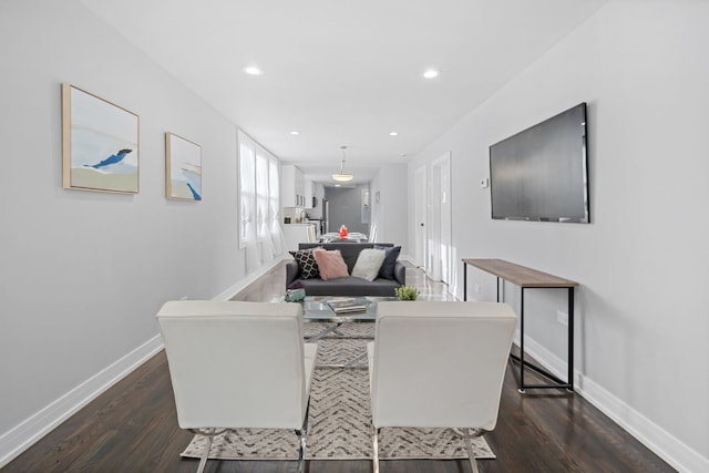 living room featuring dark wood-type flooring