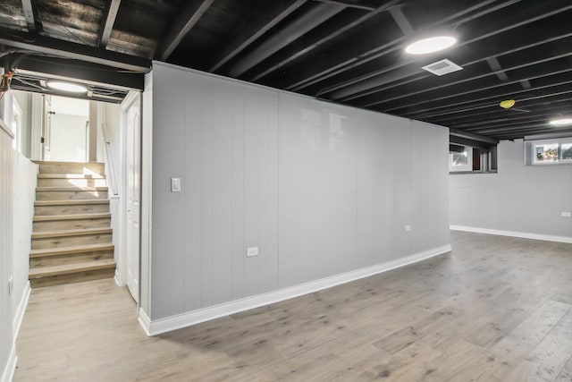 basement featuring light wood-type flooring