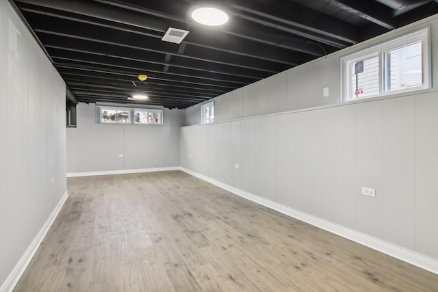 basement featuring hardwood / wood-style flooring