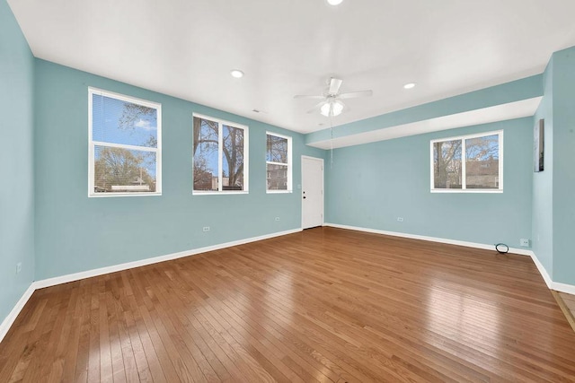 spare room featuring hardwood / wood-style flooring and ceiling fan