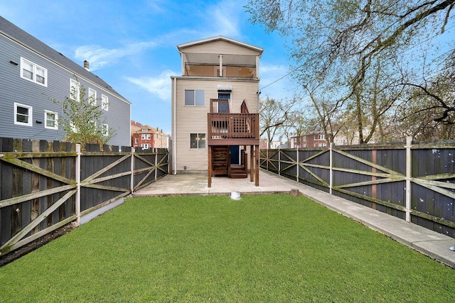 rear view of house featuring a lawn and a patio area