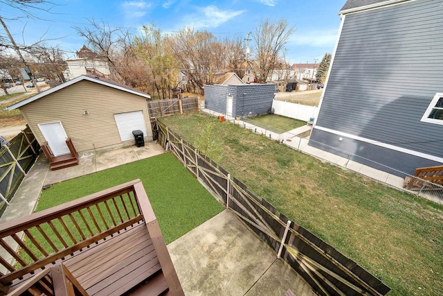 view of yard with a garage and an outdoor structure