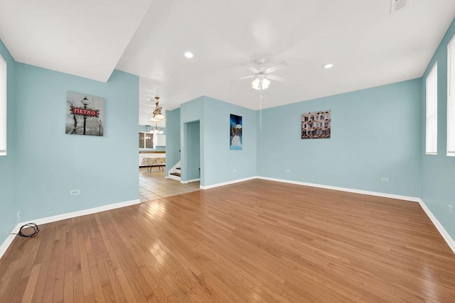 interior space with ceiling fan and light wood-type flooring