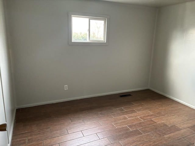 empty room featuring dark hardwood / wood-style floors