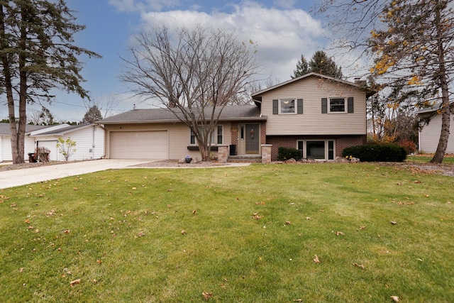 tri-level home featuring a garage and a front lawn