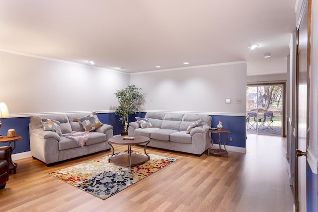 living room featuring light hardwood / wood-style floors and ornamental molding