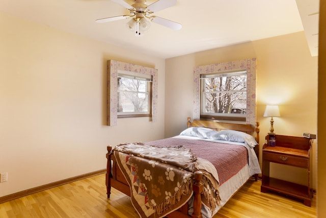 bedroom featuring light hardwood / wood-style floors and ceiling fan