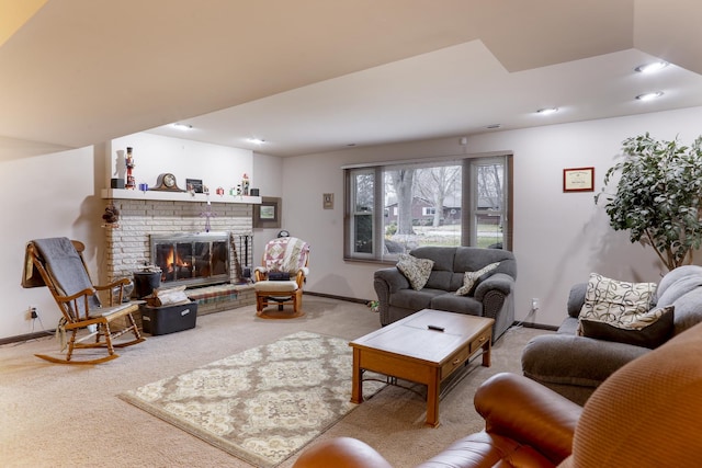 living room with carpet flooring and a brick fireplace