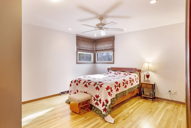 bedroom featuring hardwood / wood-style floors and ceiling fan