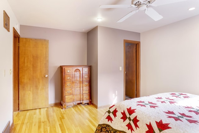 bedroom with ceiling fan and wood-type flooring