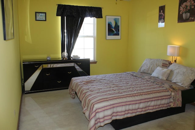 bedroom with light carpet