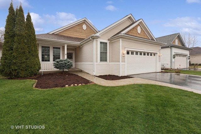 view of front facade featuring a garage and a front lawn