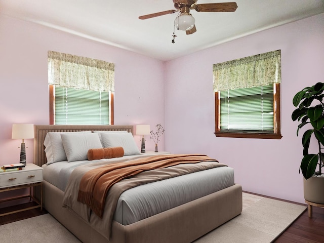 bedroom with ceiling fan and hardwood / wood-style floors