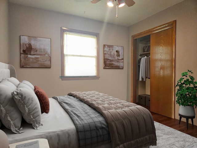 bedroom featuring ceiling fan, a closet, and dark wood-type flooring