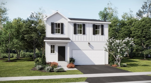 view of front of home with a garage and a front lawn