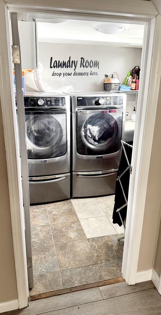 washroom featuring separate washer and dryer