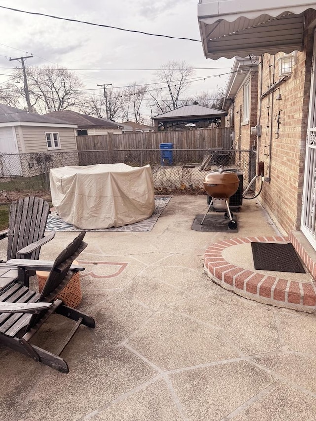 view of patio / terrace featuring an outdoor fire pit