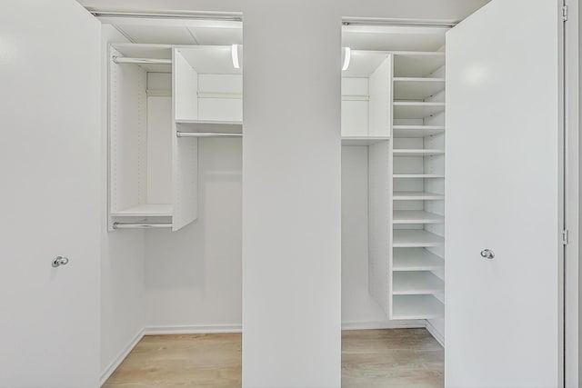 spacious closet featuring light hardwood / wood-style flooring