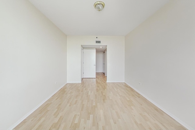 spare room featuring light hardwood / wood-style floors