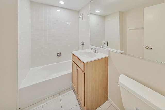 full bathroom with tile patterned floors, tiled shower / bath combo, toilet, and vanity