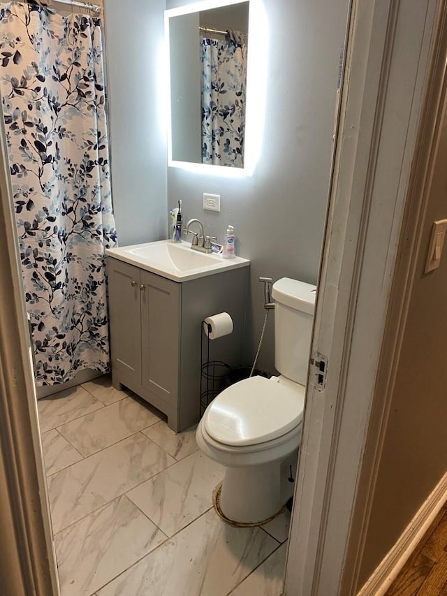 bathroom featuring vanity and toilet