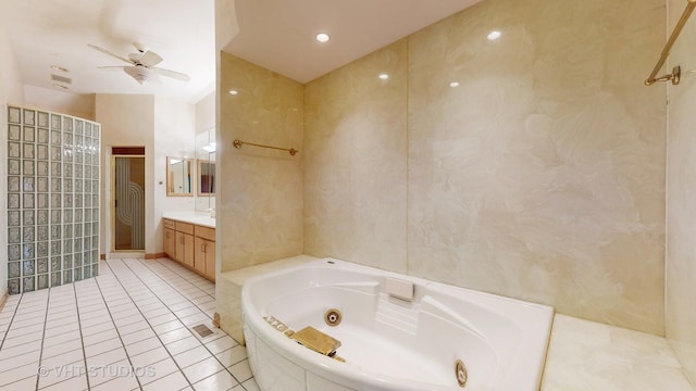 bathroom featuring tile patterned floors, vanity, ceiling fan, tile walls, and shower with separate bathtub